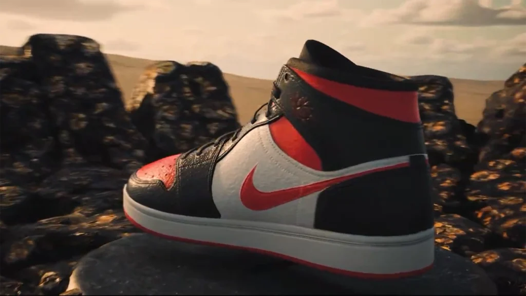 Scarpa Jordan 1 con baffo e dettagli rossi vista di lato in ambiente 3D roccioso